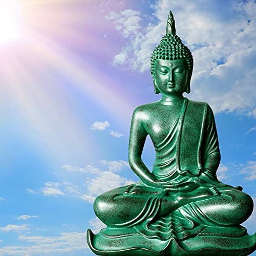 Green Buddha statue with sky background