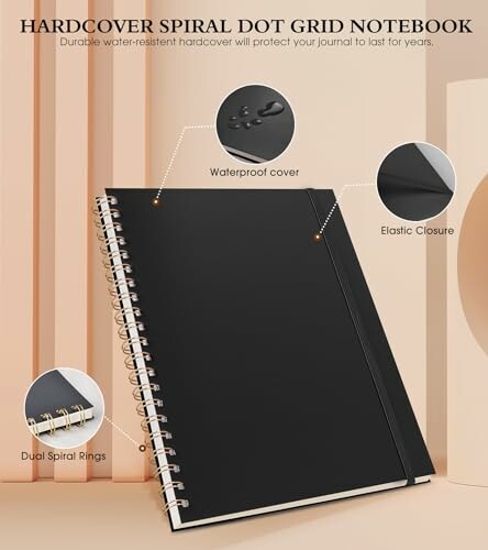 Black hardcover spiral dot grid notebook with waterproof cover and elastic closure.