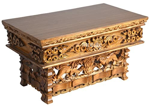 Intricately carved wooden coffee table with decorative details