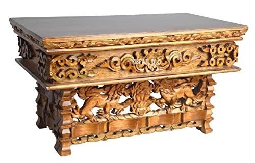 Ornately carved wooden table with intricate designs